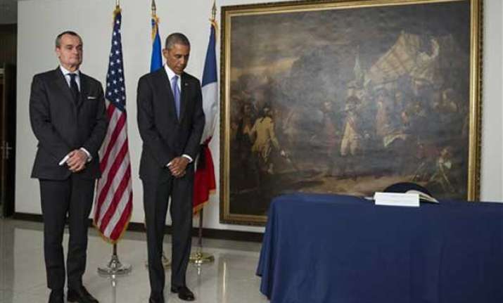 obama pays respects at french embassy after paris attack