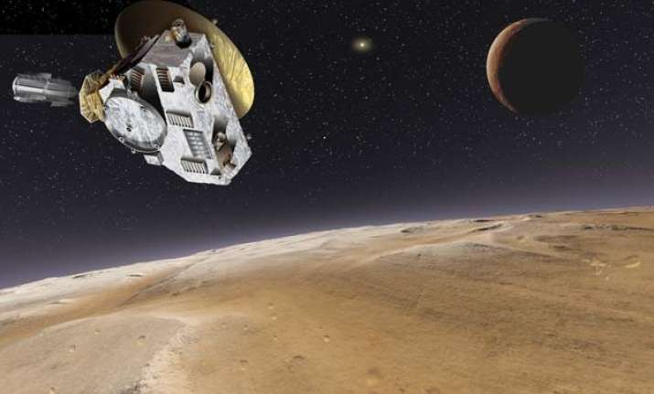 nasa probe flies past pluto world awaits historic images