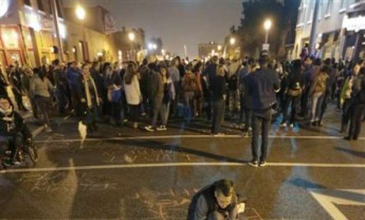 nearly 50 arrested in protest over us shootings