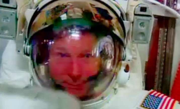 spacewalking astronaut safe after water leaks into helmet