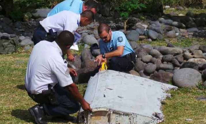 likely piece of doomed flight mh370 found in mozambique