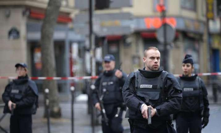 man carrying isis flag wearing fake explosives vest shot