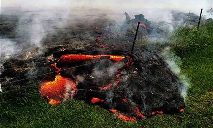 in pics red hot lava nears hawaii home and main road