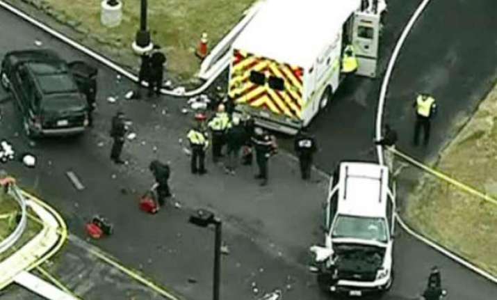 man shot dead after trying to ram a car through the gates