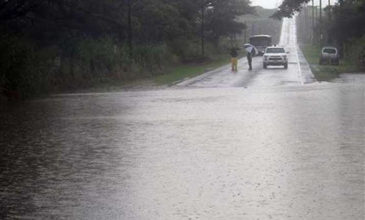 hawaii hit by winds rain as hurricane veers west