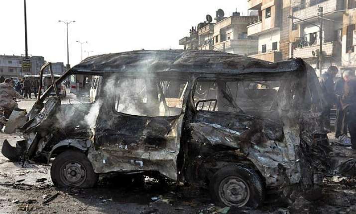 syrian tv two blasts in the city of homs 32 killed 29
