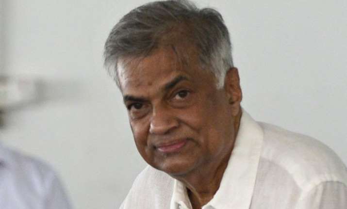 sri lanka s prime minister sworn in as 2 parties sign deal
