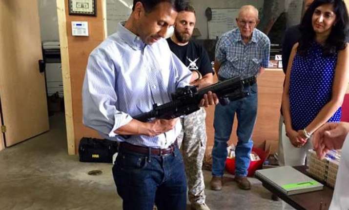 bobby jindal mocked for posing with gun at campaign stop