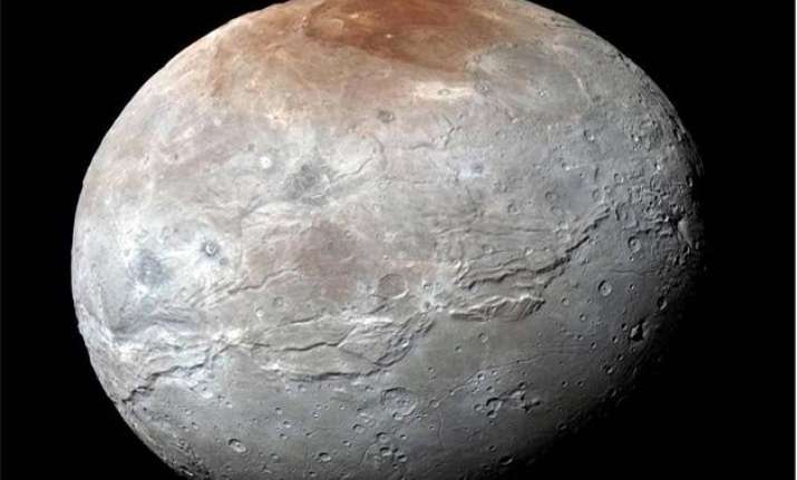 nasa releases pluto s moon charon in eye catching detail