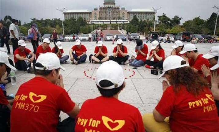 as world moves on mh370 families find solace in each other