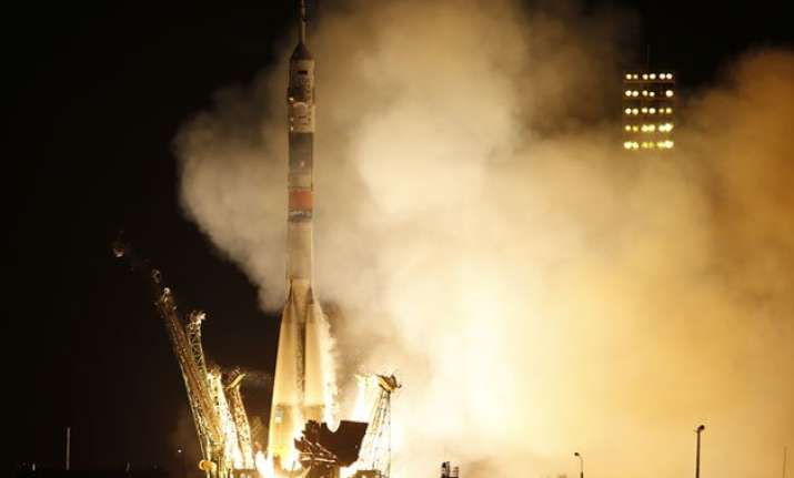 astronauts board space station for 1 year mission