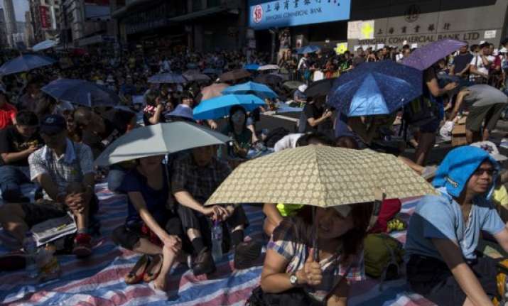 hong kong protesters threaten to occupy buildings