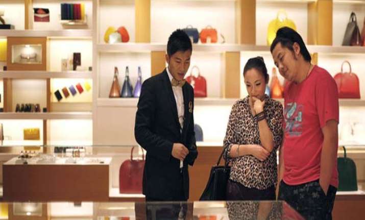 china buys half of all luxury goods report