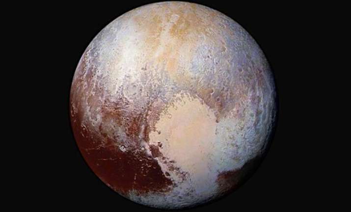 conditions on pluto incredibly hazy with flowing ice