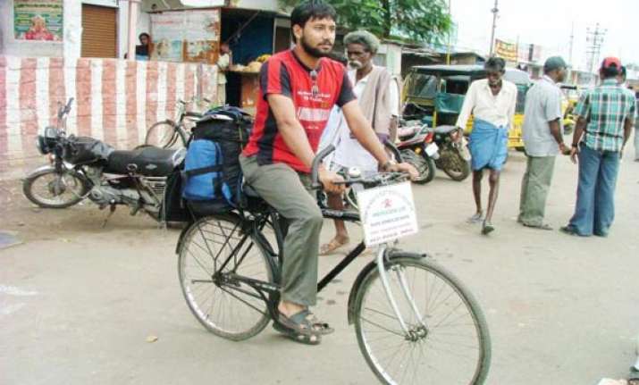 indian cyclist reaches qatar on 200 000 km trip