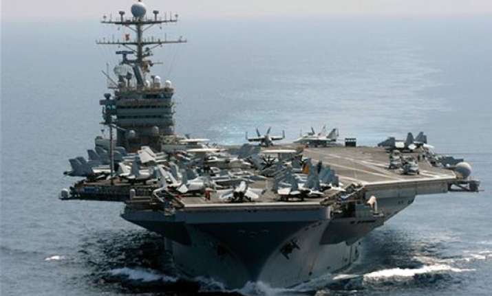 iranian boats shadow us aircraft carrier in gulf