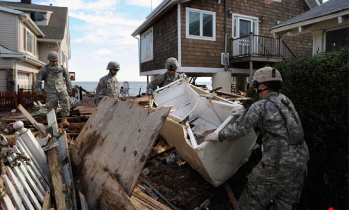 irene s death toll rises to 46 u.s. towns battle floods