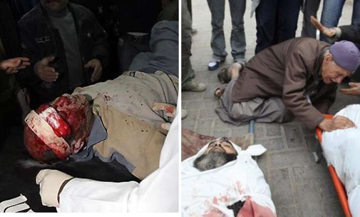 israel waits on ground assault as death toll in gaza