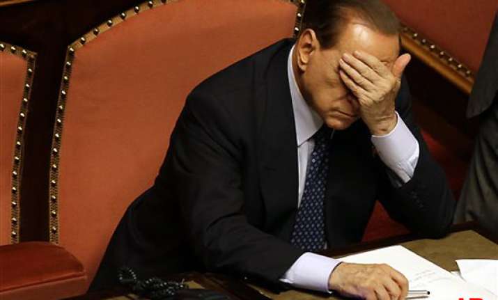 italian court sets two year political ban for berlusconi