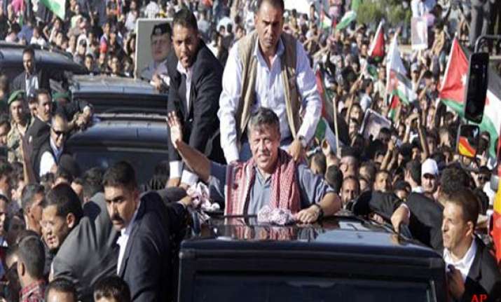 jordan king abdullah bows to demand for elected cabinets