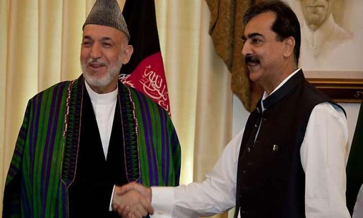 karzai calls gilani asks him to reconsider bonn boycott
