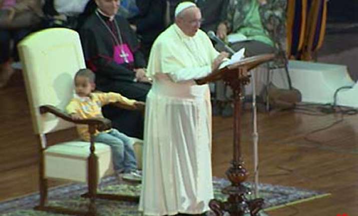 little boy sits in pope s chair steals the show
