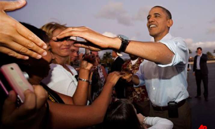 obama starts delayed hawaiian holiday