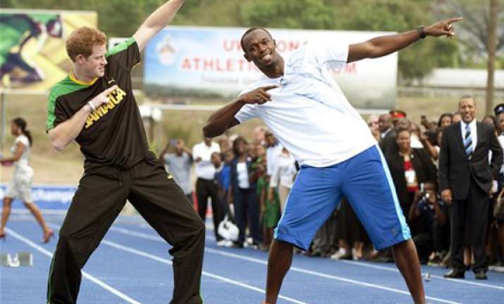prince harry runs with usain bolt in jamaica
