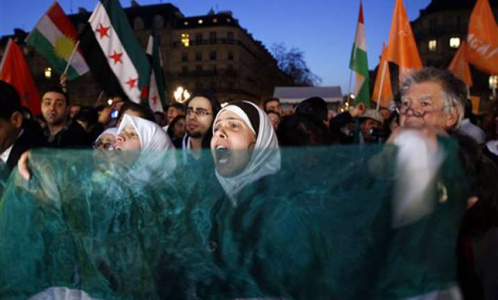 pro assad show massacre mark syria anniversary