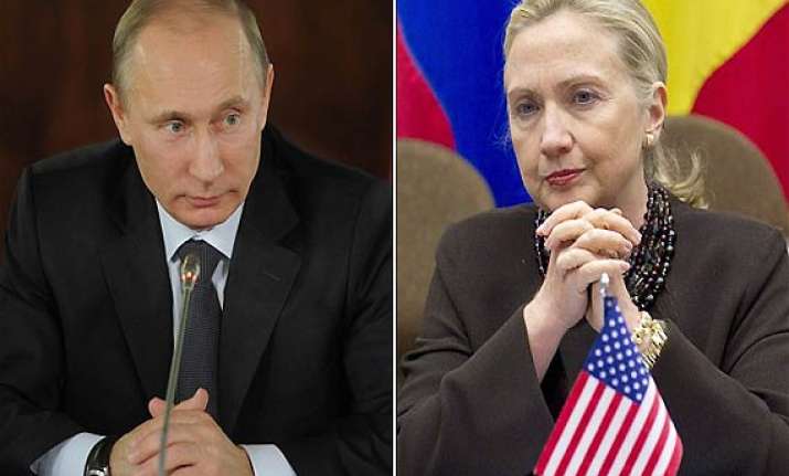 putin accuses clinton of encouraging protesters