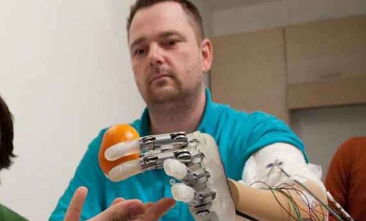scientists create prosthetic hand that feels in real time