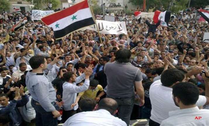 seven shot dead tanks circle syria towns activist