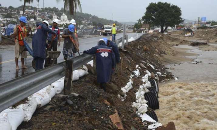 storm weakens off mexico coast still rain threat
