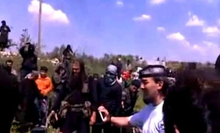syrian video shows catholic priest beheaded by militants