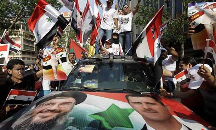 tens of thousands rally in syria against assad troops open