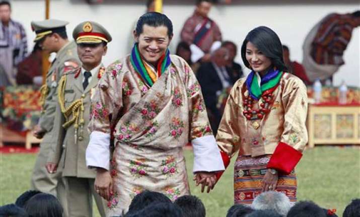 thousands greet bhutan royal couple on way to capital