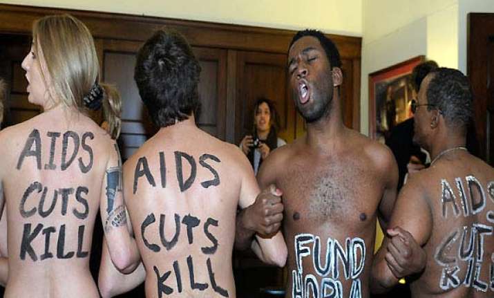 three female aids activists take off clothes in us speaker