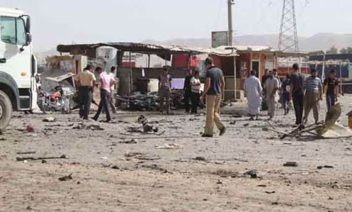 two killed 11 injured in iraq attacks
