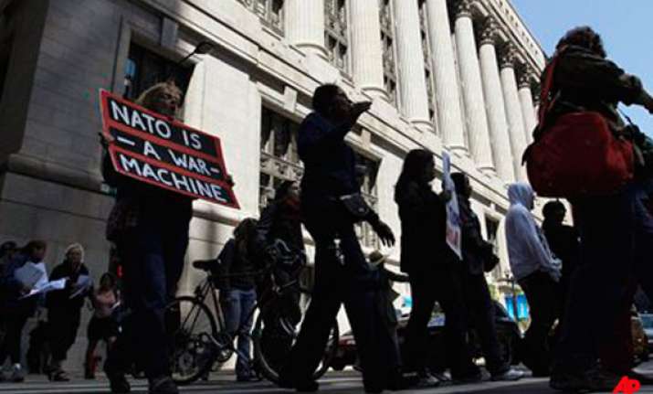 thousands gather in first major protest against nato g8