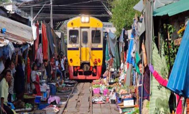 watch in pics bizarre market in vietnam where train runs