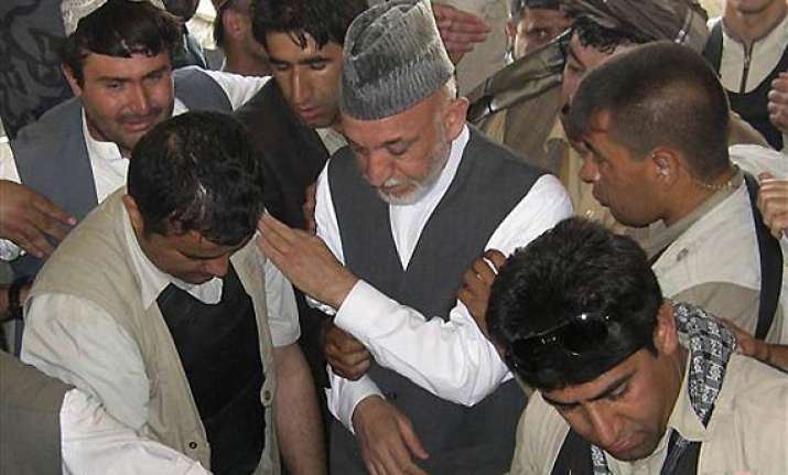 weeping afghan president buries his brother