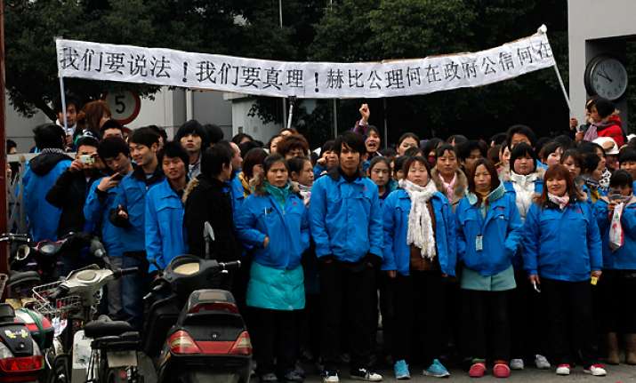 workers mass at shanghai factory in latest unrest
