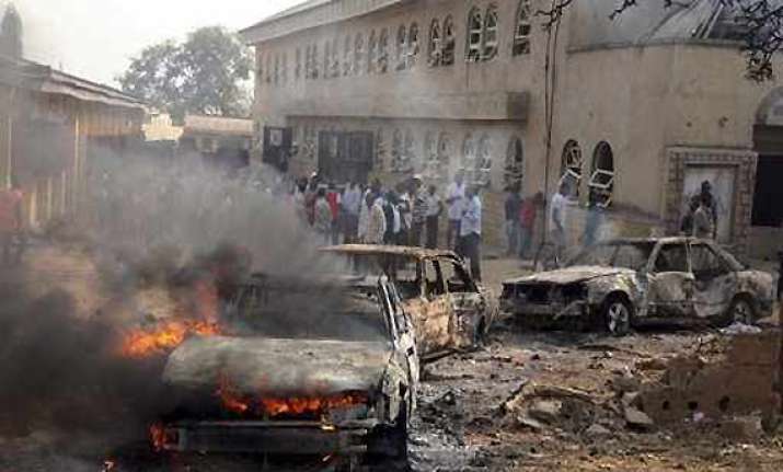 20 killed as suicide car bomber targets catholic church in