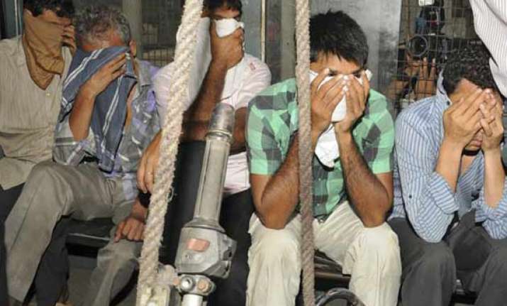 ahmedabad police seizes rs 1.28 cr cash 1 kg gold biscuits