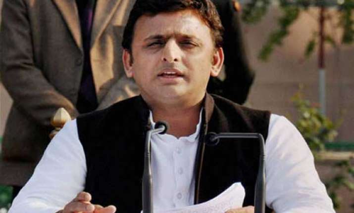 akhilesh defends vadra calls modi a model of dividing india