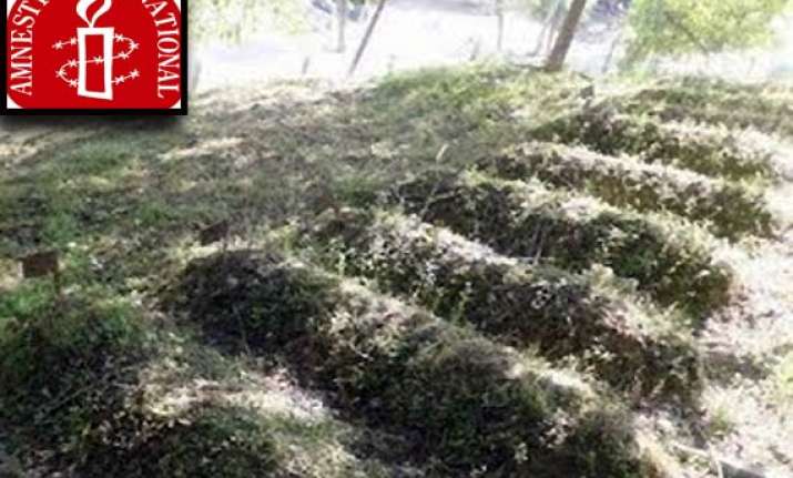 amnesty asks india to probe kashmir graves