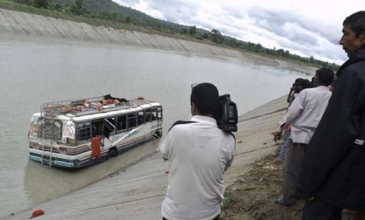 two killed over 40 feared drowned as bus falls into canal