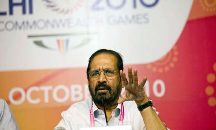 cong cracks whip on kalmadi suspends him after cbi arrest