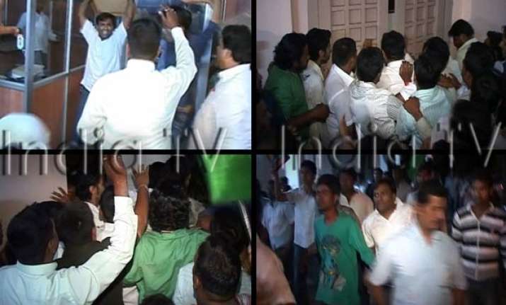 congress workers ransack kalmadi s office in pune