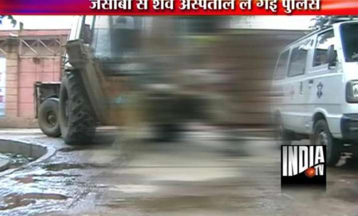 dead body taken on jcb machine two policemen suspended